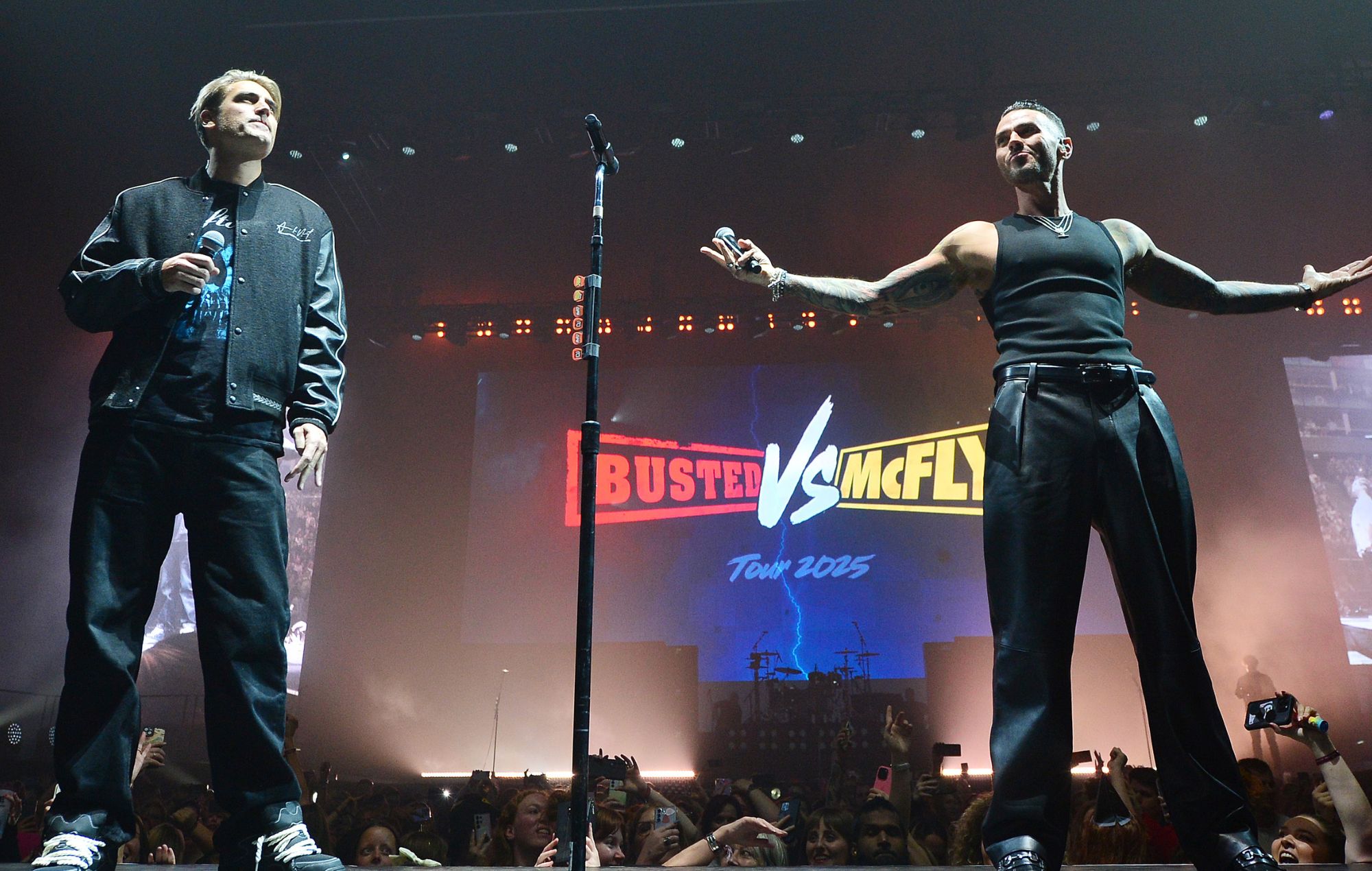 Busted storm the stage, during McFly's 21st Birthday show, to announce a 'Busted vs McFly' tour.