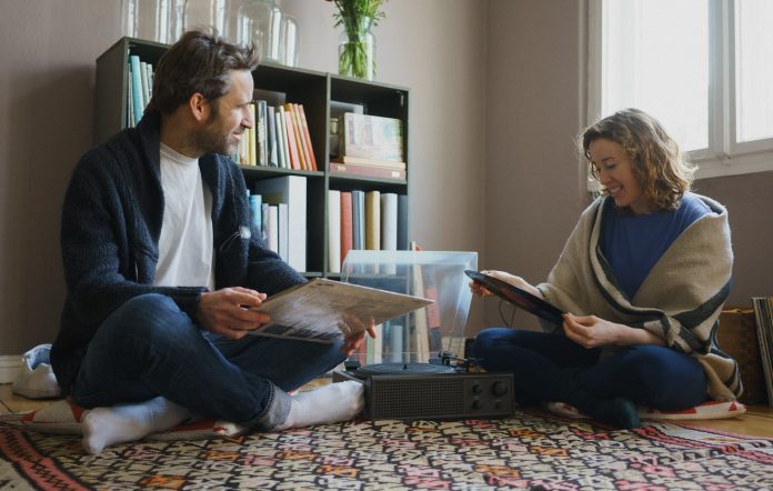 Couple playing vinyl music